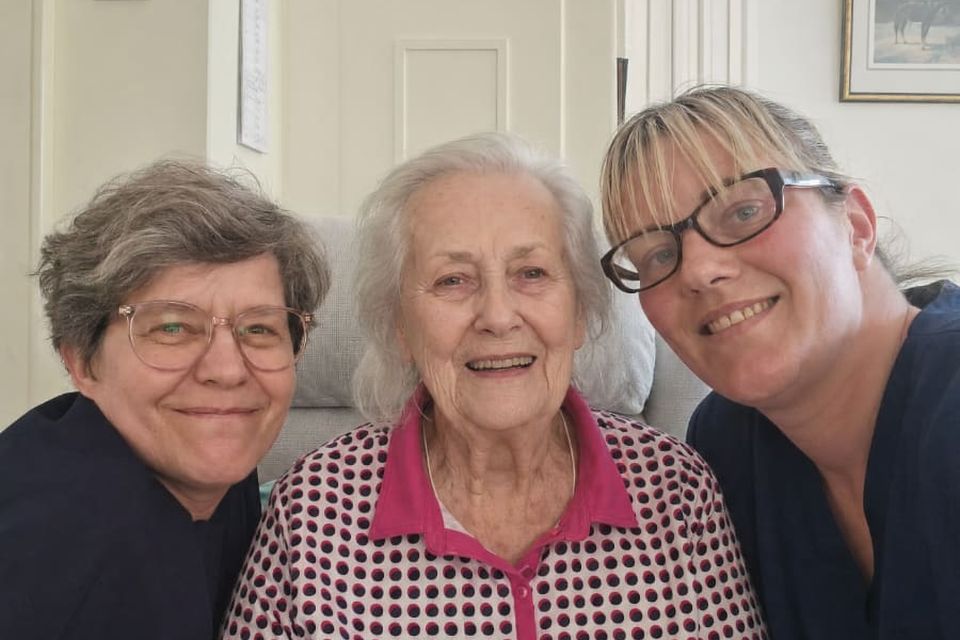 A Helping at Home carer with a client and her daughter, at home in Nottinghamshire